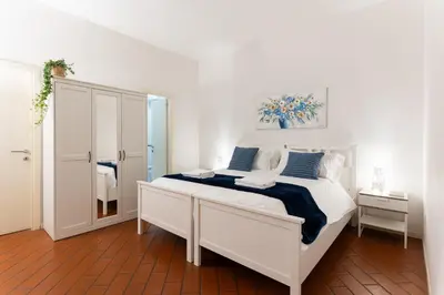 Letto o letti in una camera di Faenza Home