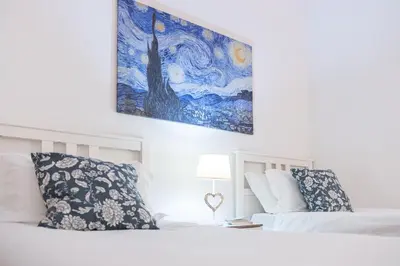 Letto o letti in una camera di Faenza Home