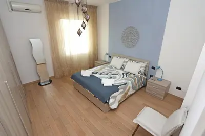 Letto o letti in una camera di Sunshine Apartment in Florence
