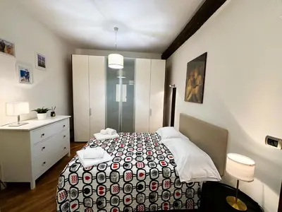 Letto o letti in una camera di San Paolino Relax Firenze