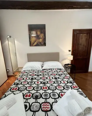 Letto o letti in una camera di San Paolino Relax Firenze