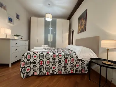 Letto o letti in una camera di San Paolino Relax Firenze