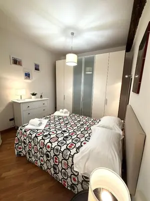 Letto o letti in una camera di San Paolino Relax Firenze