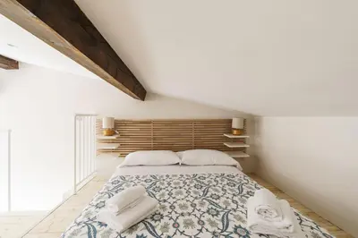 Letto o letti in una camera di Giusti Palace By San Firenze Collection