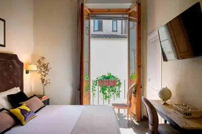 Letto o letti in una camera di Mabelle Firenze Residenza Sassetti