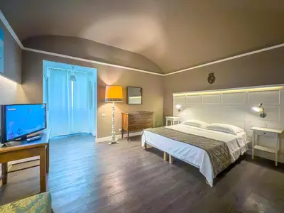 Letto o letti in una camera di B&B Villa Le Farnete