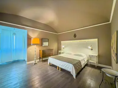 Letto o letti in una camera di B&B Villa Le Farnete