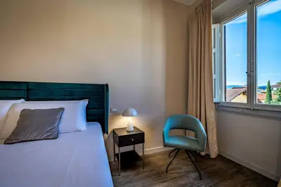Letto o letti in una camera di YD charming two-level apartment in central Florence