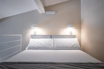 Letto o letti in una camera di YD charming two-level apartment in central Florence