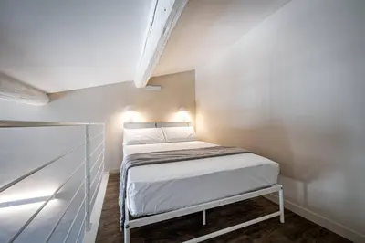 Letto o letti in una camera di YD charming two-level apartment in central Florence