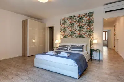Letto o letti in una camera di Oricellari Apartment by Mamo Florence