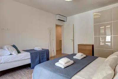 Letto o letti in una camera di Oricellari Apartment by Mamo Florence