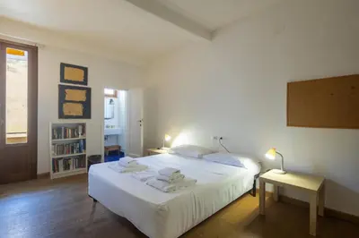 Letto o letti in una camera di Sant'Ambrogio 3-Bedroom Apartment