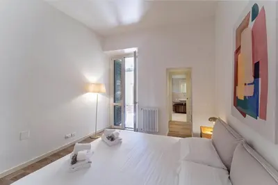Letto o letti in una camera di UNYCA - Elegant 3-bedroom Apartment in Florence