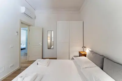 Letto o letti in una camera di UNYCA - Elegant 3-bedroom Apartment in Florence