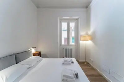 Letto o letti in una camera di UNYCA - Elegant 3-bedroom Apartment in Florence