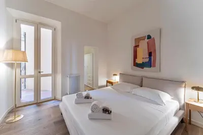 Letto o letti in una camera di UNYCA - Elegant 3-bedroom Apartment in Florence
