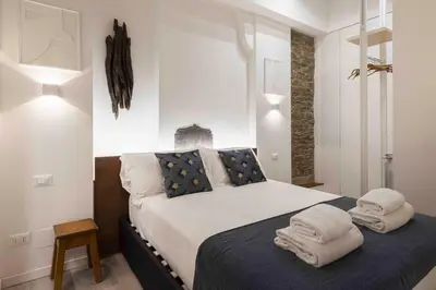 Letto o letti in una camera di Deluxe Pitti Suites by MMega