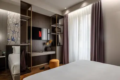 Letto o letti in una camera di ROOM 101 by Aramis