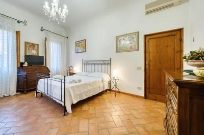 Letto o letti in una camera di Maggio - Boutique Home in Florence