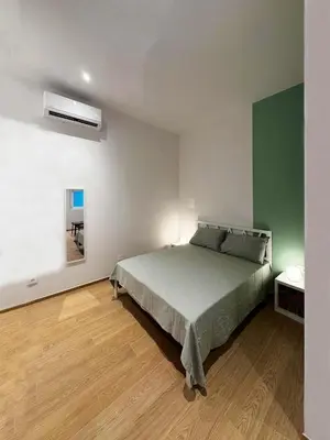 Letto o letti in una camera di Appartamento Bianca