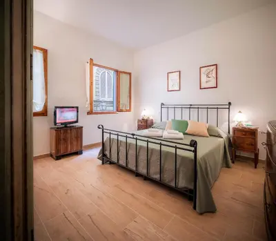 Letto o letti in una camera di Novella Benedicta Apartments