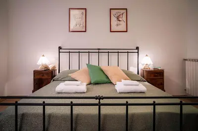 Letto o letti in una camera di Novella Benedicta Apartments