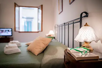 Letto o letti in una camera di Novella Benedicta Apartments