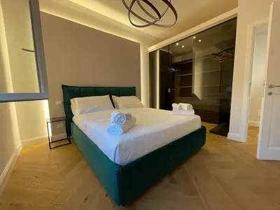 Letto o letti in una camera di Attico di lusso elegante e moderno
