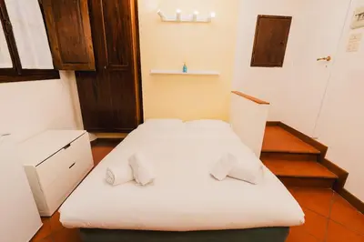 Letto o letti in una camera di Vigna Vecchia Cozy Apartment