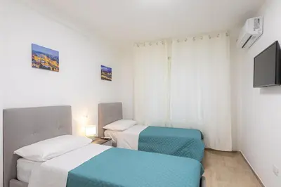 Letto o letti in una camera di Sara Home Flo