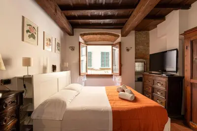 Letto o letti in una camera di Keys of Italy- CorsoB-9- Studio by Palazzo Vecchio