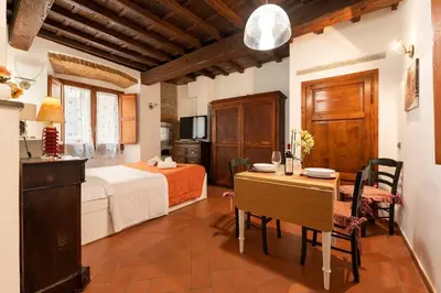 Letto o letti in una camera di Keys of Italy- CorsoB-9- Studio by Palazzo Vecchio