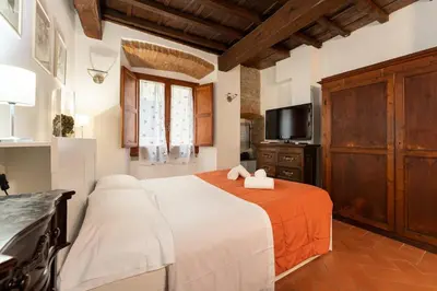 Letto o letti in una camera di Keys of Italy- CorsoB-9- Studio by Palazzo Vecchio