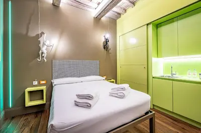 Letto o letti in una camera di Pop Tower Florence