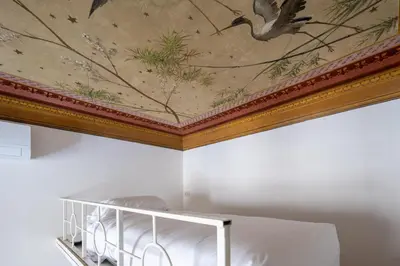 Letto o letti in una camera di Florence Large Frescoed Apartment