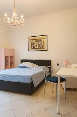 Letto o letti in una camera di Le Stanze di Barbara
