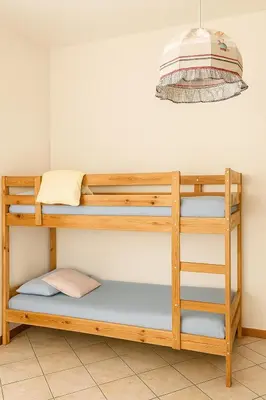 Letto o letti in una camera di Le Stanze di Barbara