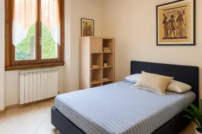 Letto o letti in una camera di Le Stanze di Barbara