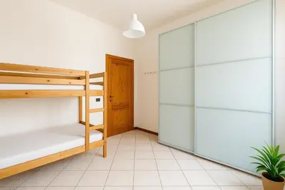 Letto o letti in una camera di Le Stanze di Barbara