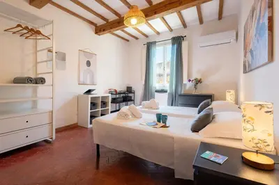 Letto o letti in una camera di Keys of Italy-AllegriBig4-Family 2bedr Santa Croce