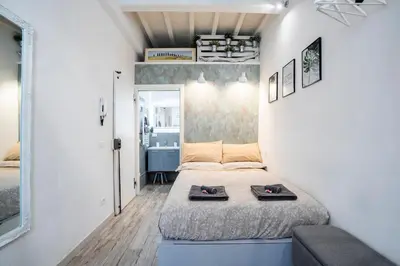 Letto o letti in una camera di Suite Firenze Centrale Duomo, Stazione, Mercato