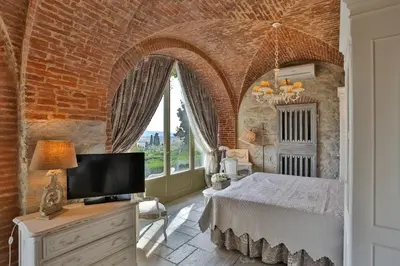 Letto o letti in una camera di Villa Le Fontanelle