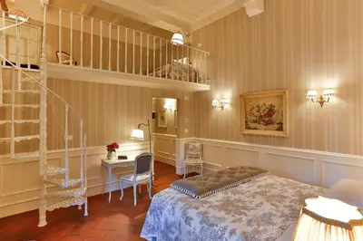 Letto o letti in una camera di Villa Le Fontanelle