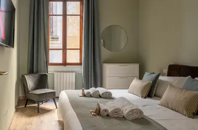 Letto o letti in una camera di Augustus Florence Borgo Pinti 3 min Duomo