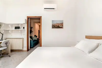 Letto o letti in una camera di Heart of Florence Apartment