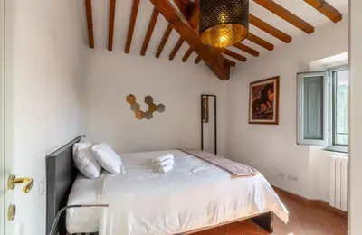 Letto o letti in una camera di Appartamento Elisa, immerso nella natura e vicino a Firenze