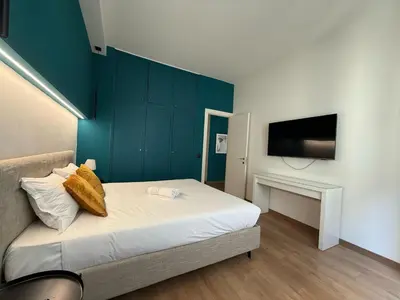 Letto o letti in una camera di GuestHost - Ponte Vecchio Charming Nest