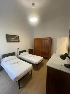 Letto o letti in una camera di Caravaggio