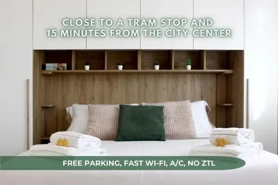 Letto o letti in una camera di 15min to Downtown, Welcoming Apt near tram T1